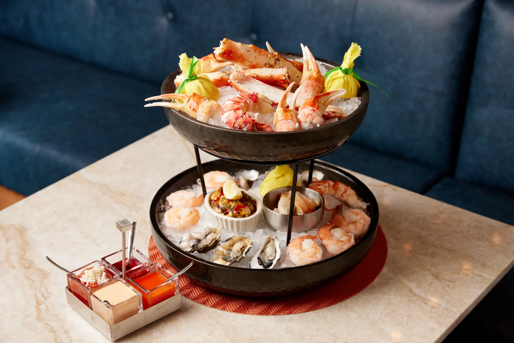 Commission Row signature dishes Dry-Aged and Wet-Aged Steaks, Raw Bar selections, Lobster.